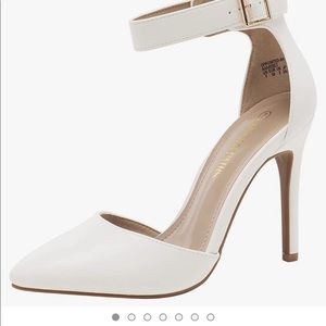 NEVER WORN still in box. Size 9, white, pointed toe 4” heel with buckle strap.
